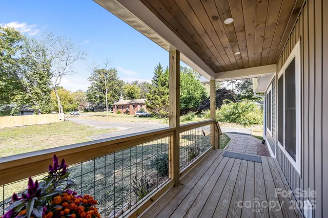 a living room with furniture fireplace and window