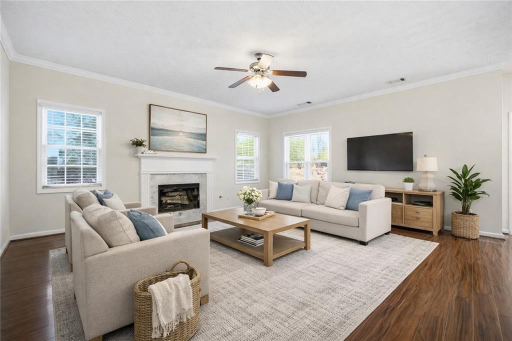 3393 Morning Top Place Suwanee, GA 30024 - Photo 14 of 34 a living room with furniture fireplace and flat screen tv