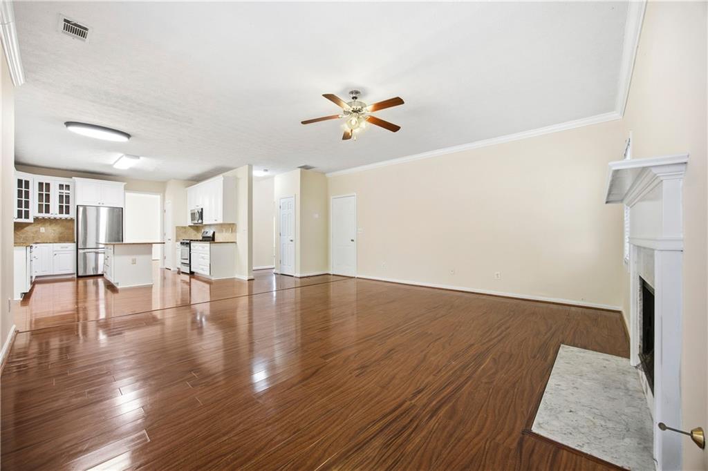 3393 Morning Top Place Suwanee, GA 30024 - Photo 15 of 34 a view of empty room with wooden floor