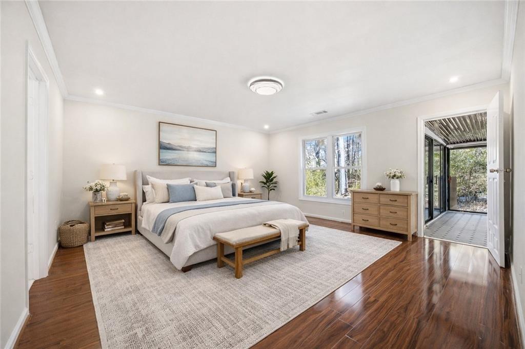 3393 Morning Top Place Suwanee, GA 30024 - Photo 20 of 34 a spacious bedroom with a bed couch and a window