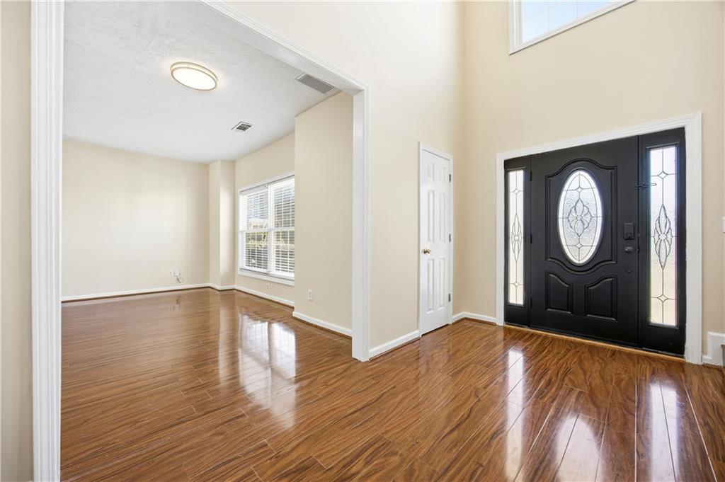 3393 Morning Top Place Suwanee, GA 30024 - Photo 4 of 34 a view of a room with wooden floor