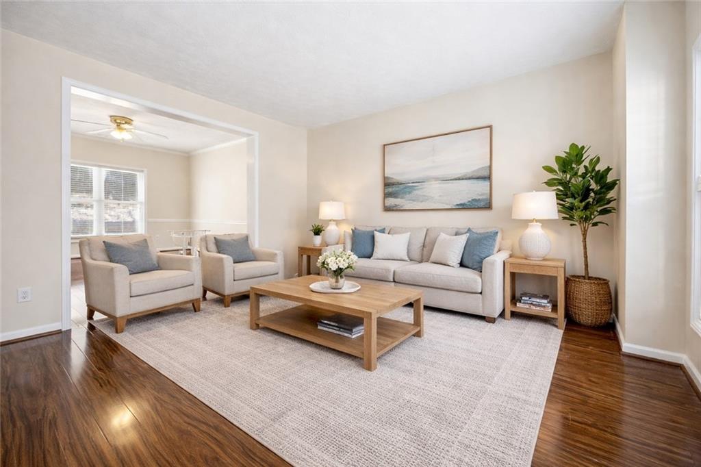 3393 Morning Top Place Suwanee, GA 30024 - Photo 6 of 34 a living room with furniture and a potted plant