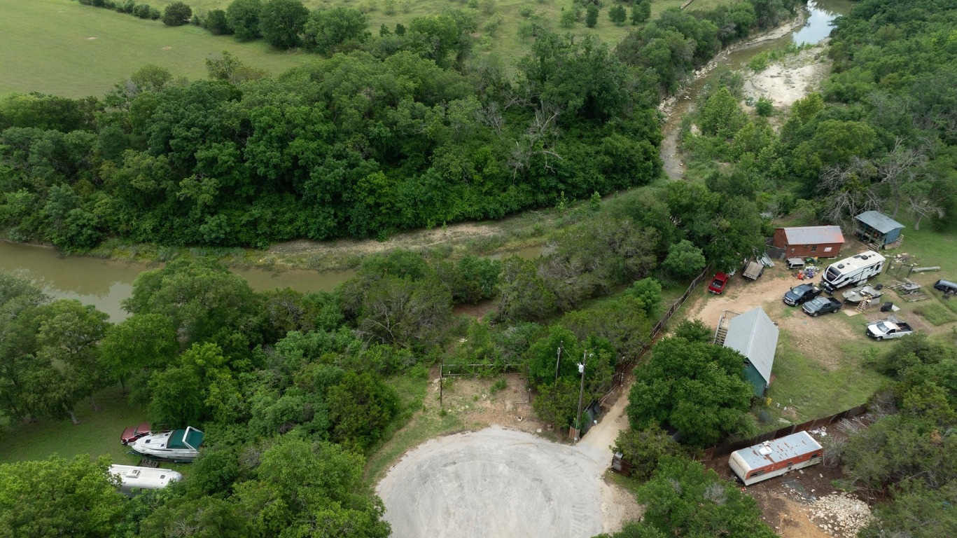 1620 San Gabriel Ranch Road Liberty Hill, TX 78642 - Photo 19 of 34 an aerial view of residential house with outdoor space and trees all around