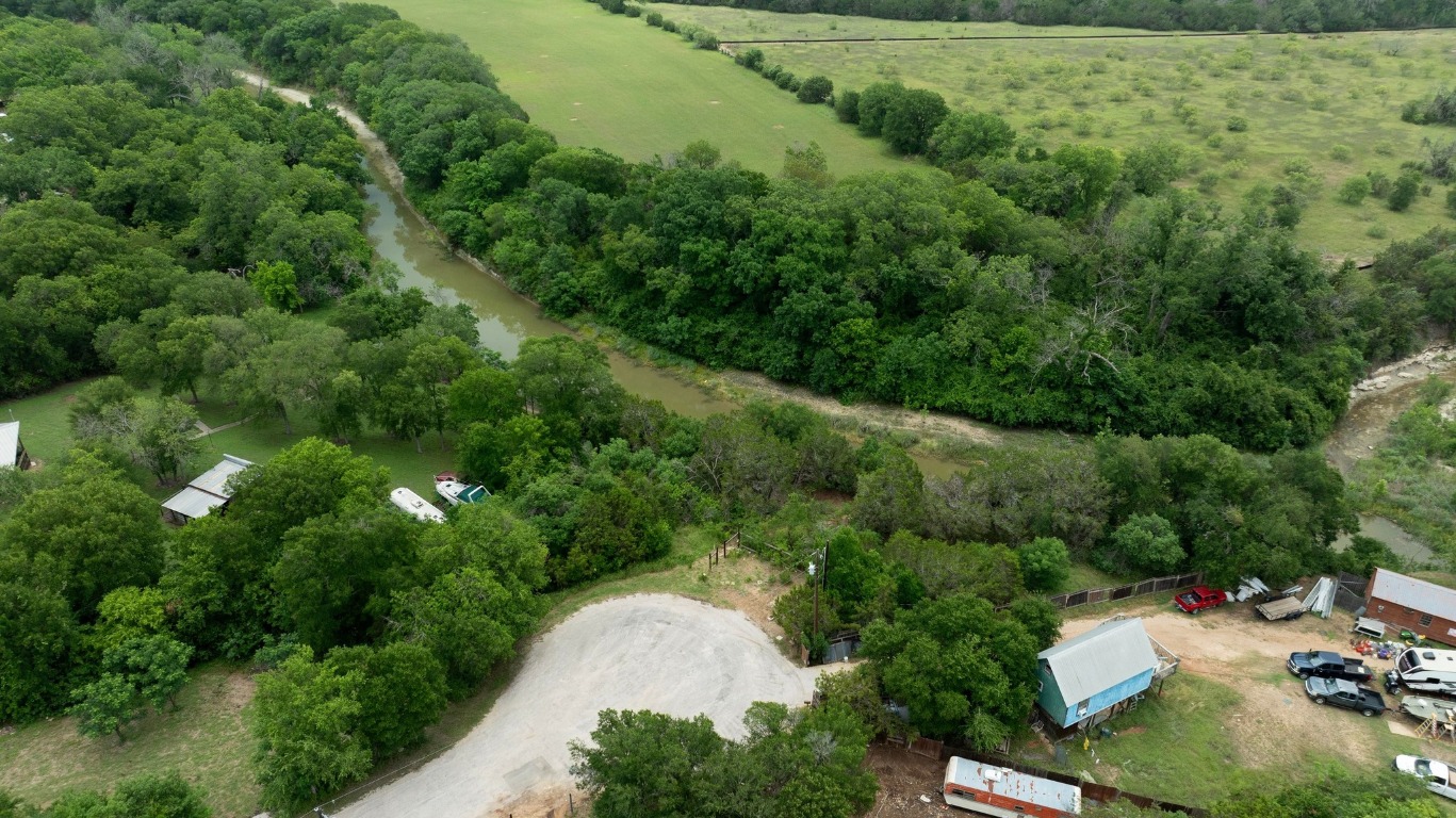1620 San Gabriel Ranch Road Liberty Hill, TX 78642 - Photo 20 of 34 an aerial view of residential house with outdoor space and trees all around