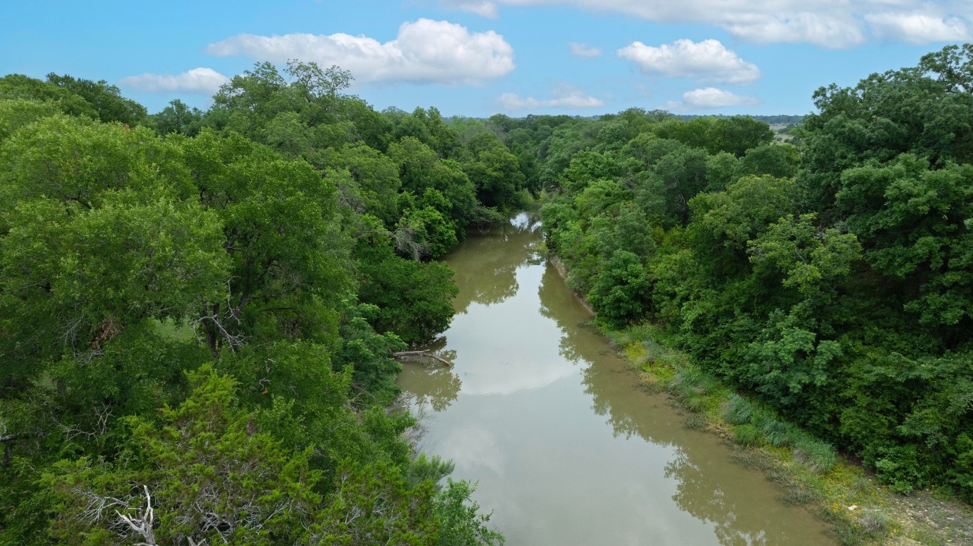 1620 San Gabriel Ranch Road Liberty Hill, TX 78642 - Photo 2 of 34 a view of a lake view with houses in the back