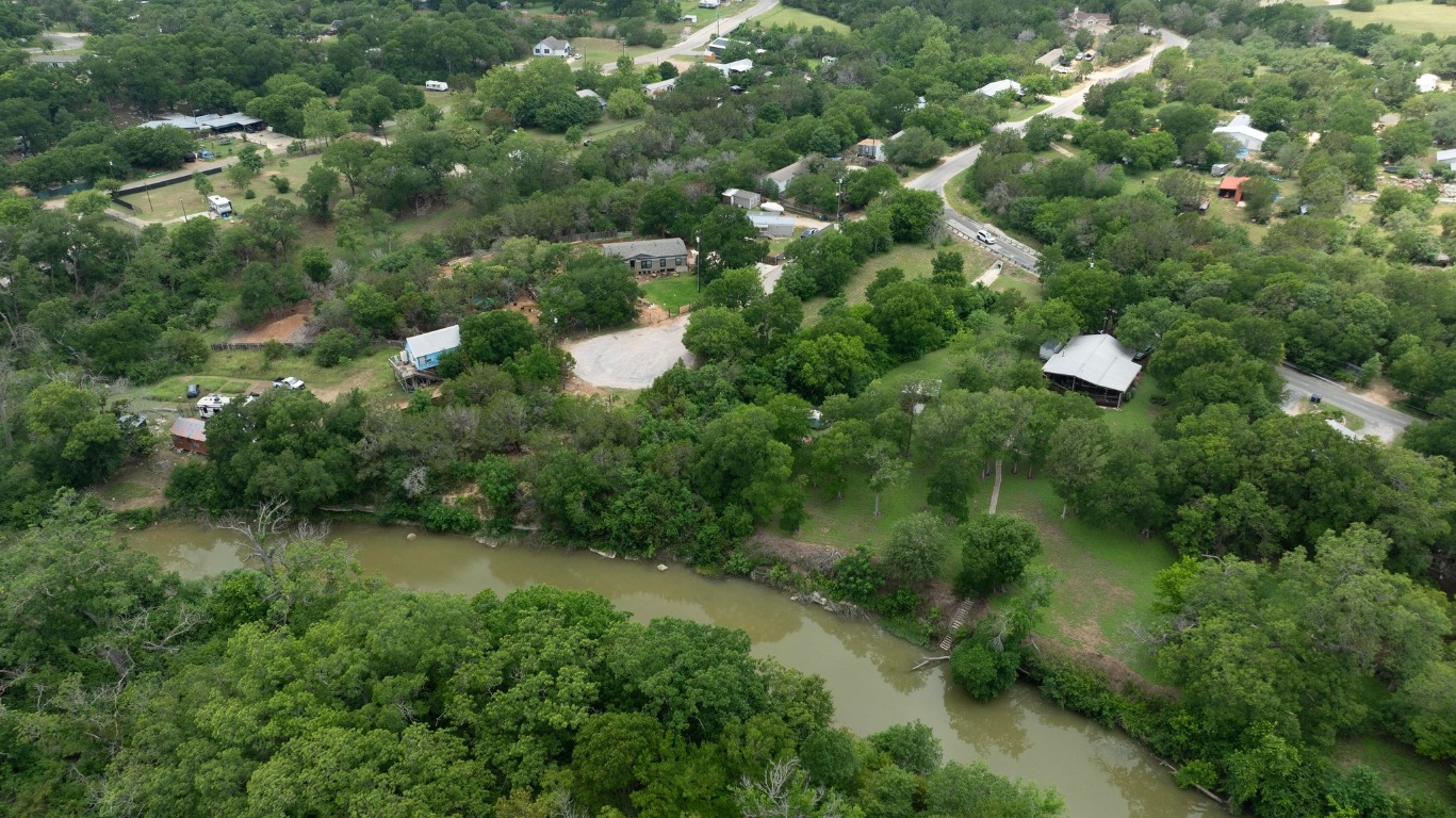1620 San Gabriel Ranch Road Liberty Hill, TX 78642 - Photo 23 of 34 an aerial view of residential houses with outdoor space and trees