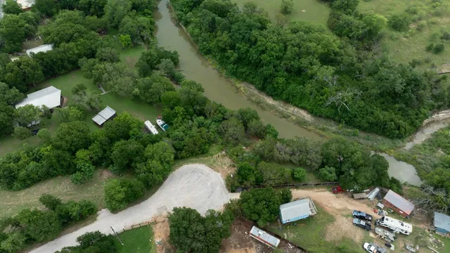 an aerial view of a house with yard