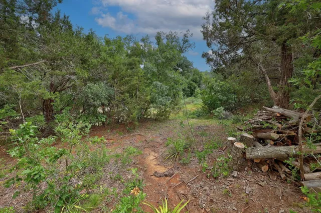 a view of a lake with a yard