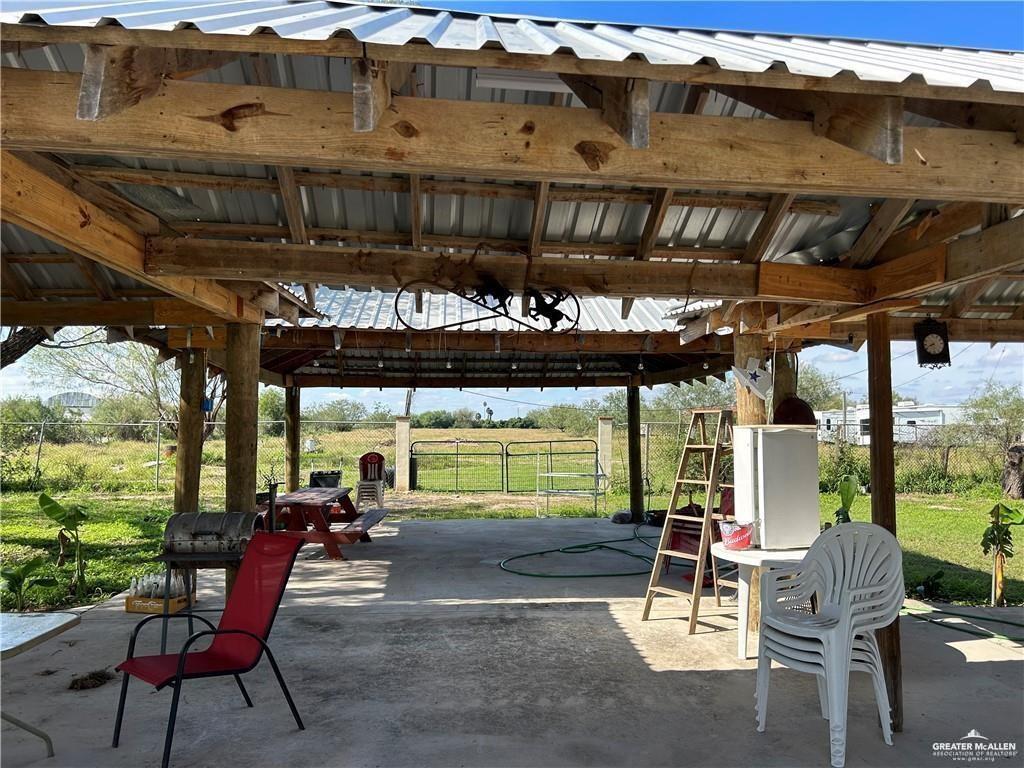 9433 North Minnesota Road Mission, TX 78574 - Photo 4 of 18 a view of a chairs and table in patio