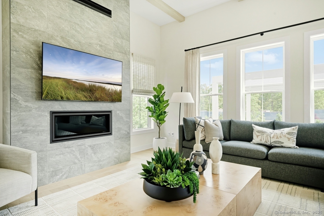 6 Thorncrest Ridge, Unit 72 Danbury, CT 06810 - Photo 4 of 16 a living room with furniture and a fireplace