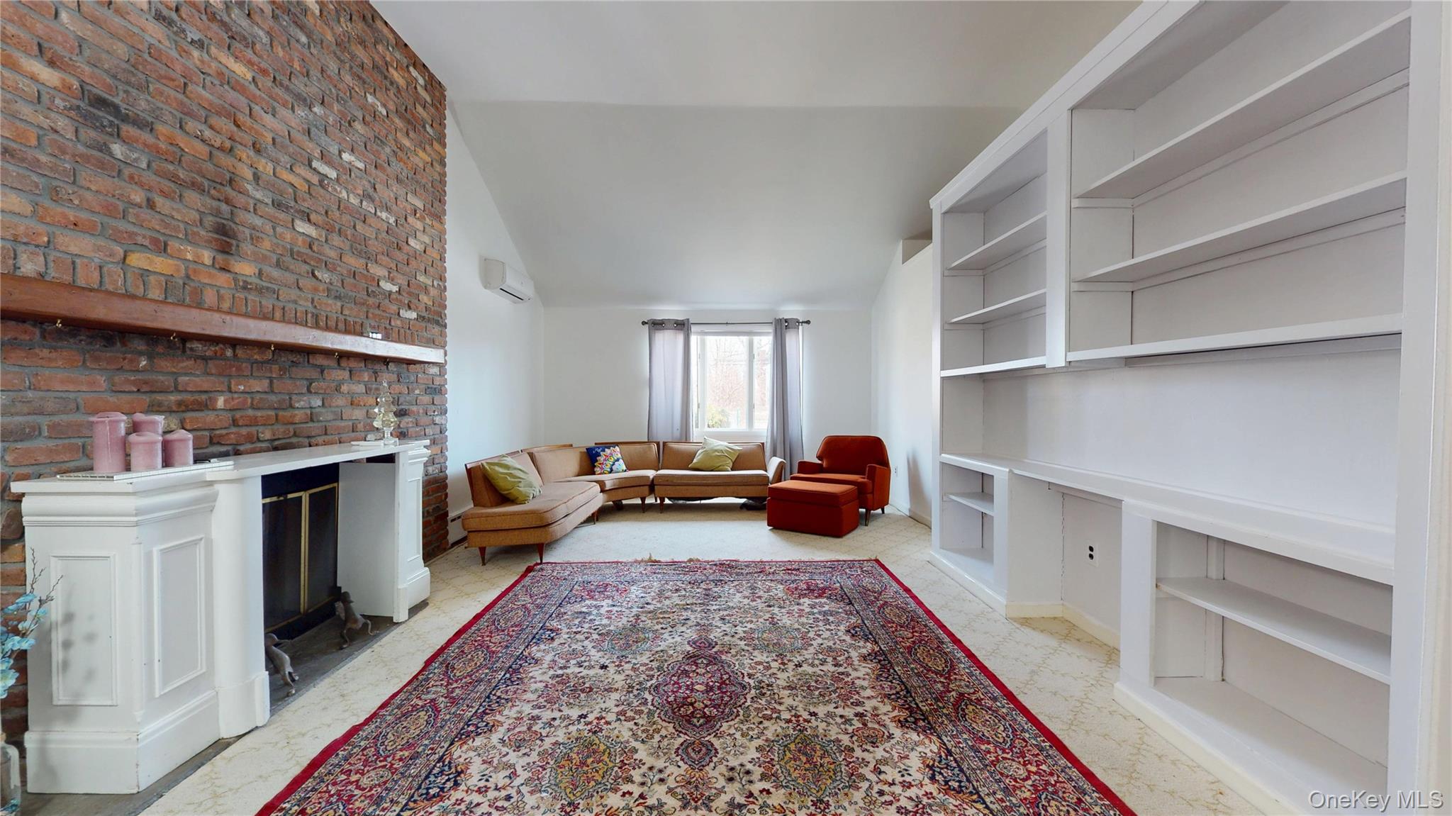 a living room with furniture and a rug