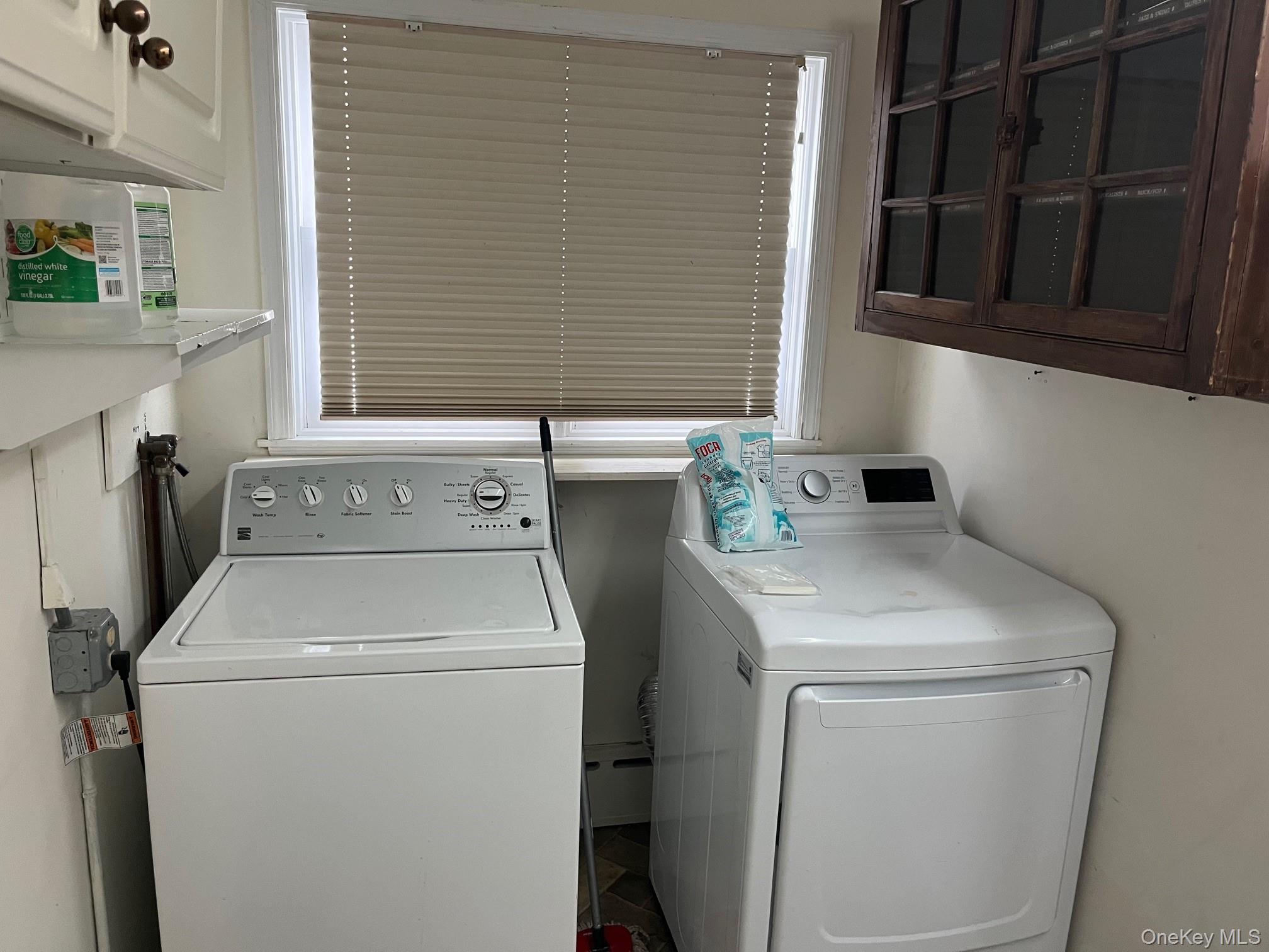 178 Barnes Road, Unit MAIN HOUSE Brookhaven, NY 11955 - Photo 10 of 17 a utility room with dryer and washer