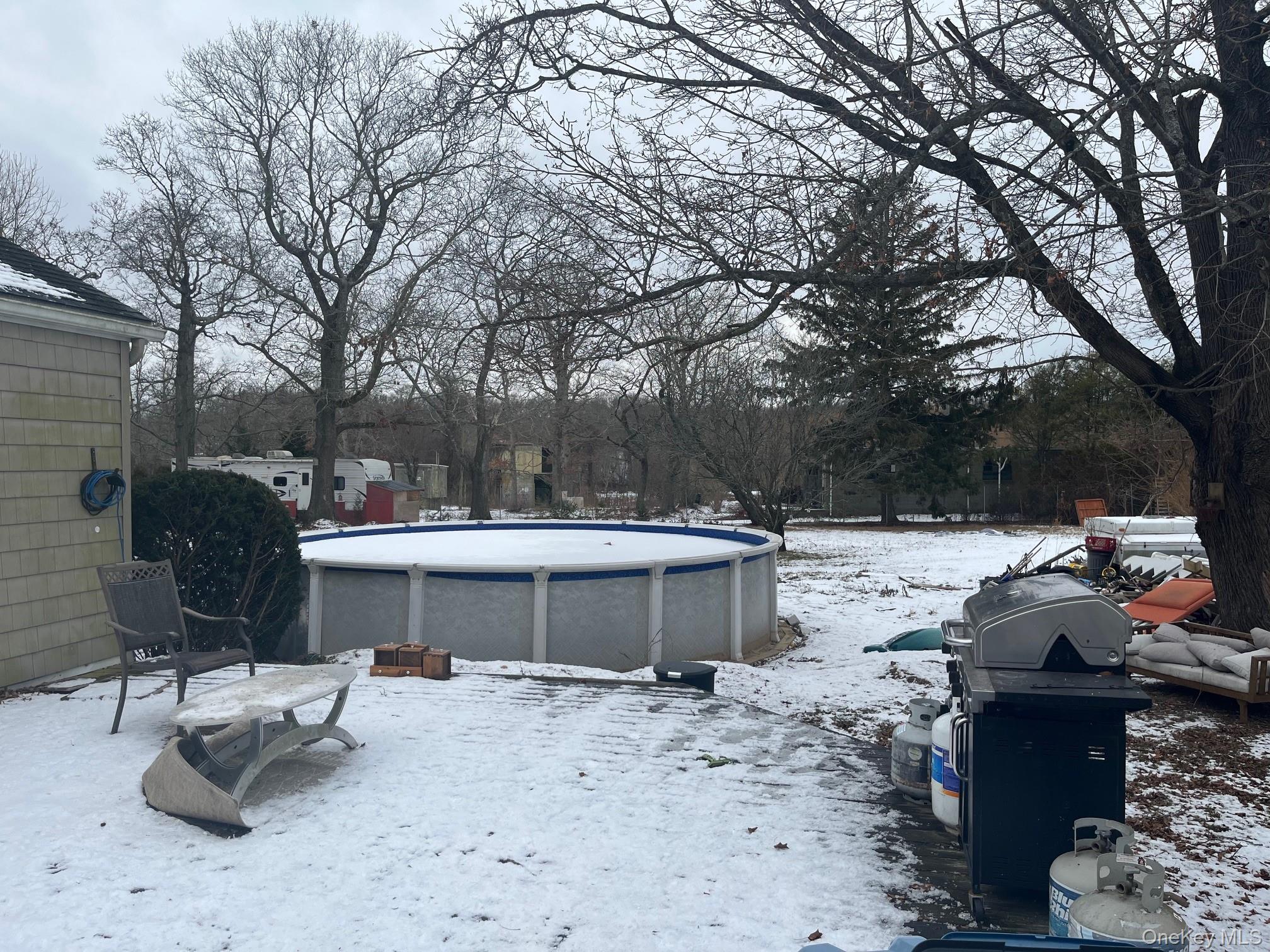178 Barnes Road, Unit MAIN HOUSE Brookhaven, NY 11955 - Photo 13 of 17 a view of backyard with sitting area