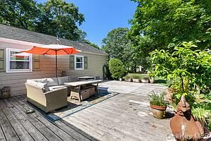 178 Barnes Road, Unit MAIN HOUSE Brookhaven, NY 11955 - Photo 2 of 5 Wooden deck with an outdoor living space
