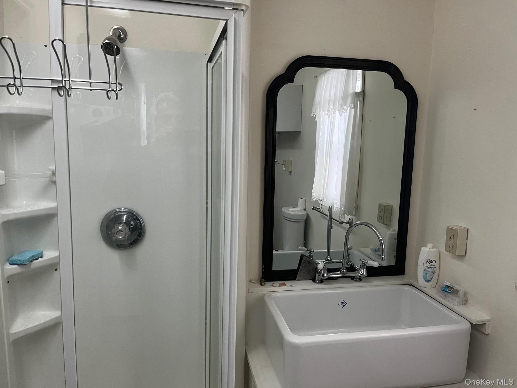 178 Barnes Road, Unit MAIN HOUSE Brookhaven, NY 11955 - Photo 7 of 17 a bathroom with a tub and shower