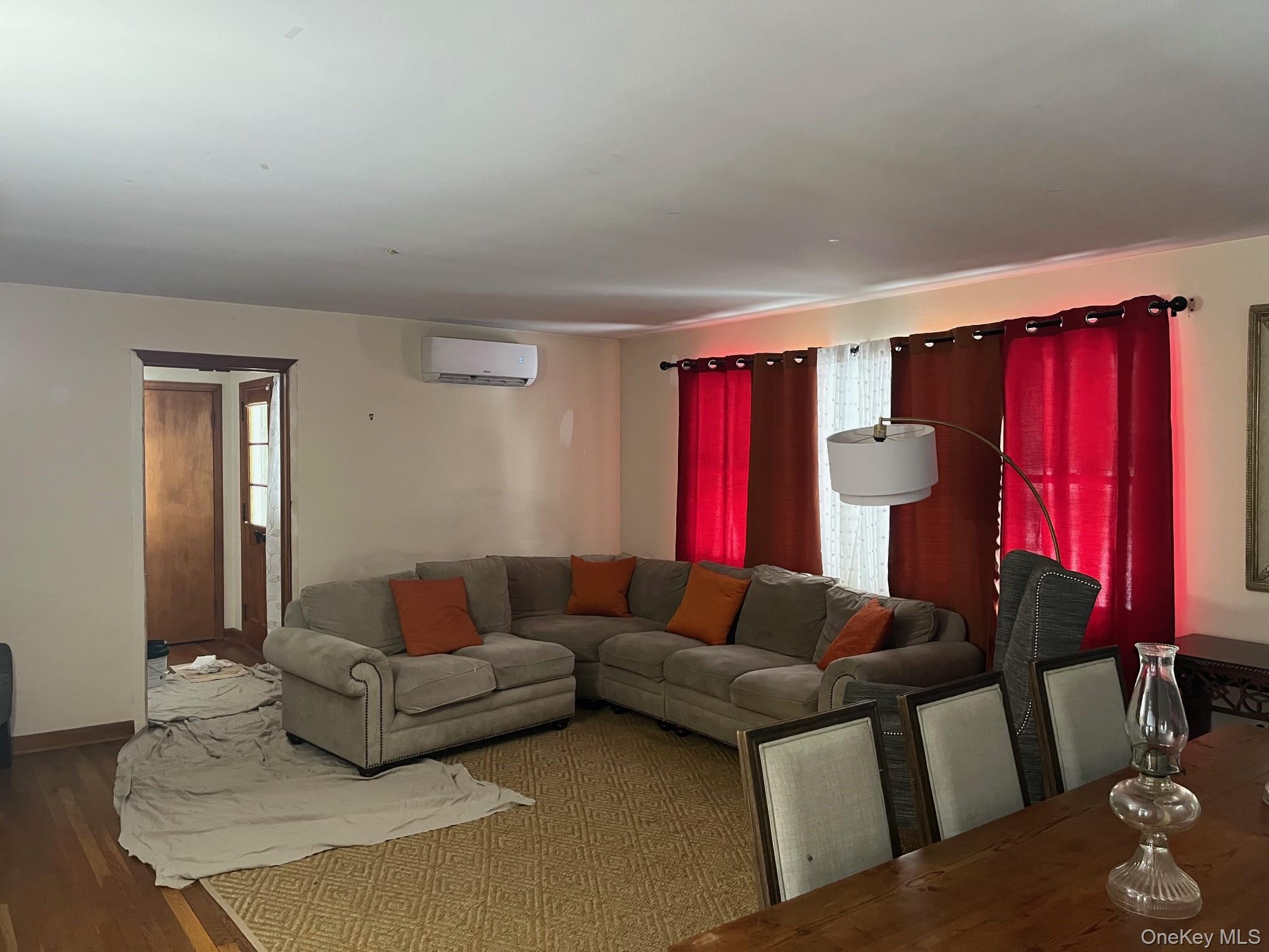 178 Barnes Road, Unit MAIN HOUSE Brookhaven, NY 11955 - Photo 9 of 17 a living room with furniture and a window