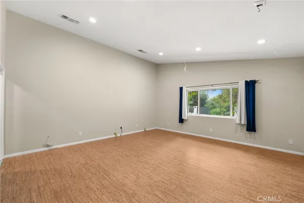 a bed room with a bed and a night stand