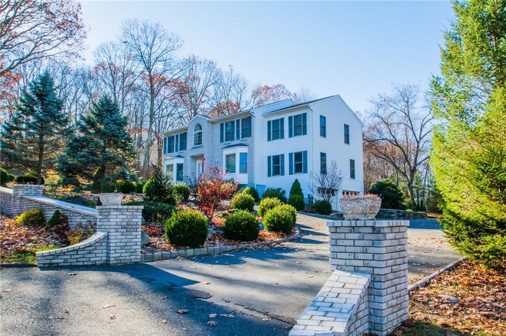 4 Fox Den Road Danbury, CT 06811 - Photo 1 of 1 a front view of a house with a garden