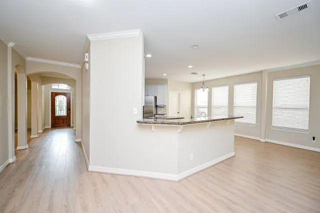 a view of kitchen with wooden floor