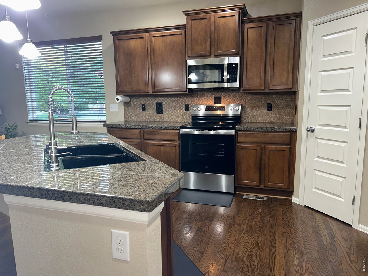 5543 Calgary Street Timnath, CO 80547 - Photo 8 of 39 Kitchen with All New Appliances!!