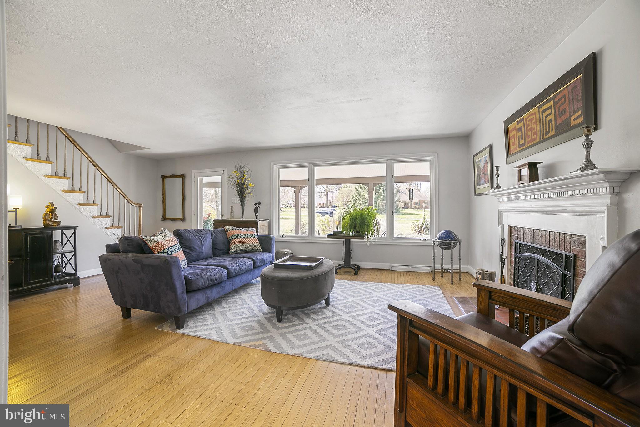 828 Merrill Road Ambler, PA 19002 - Photo 5 of 31 Living room with picture window overlooking pond