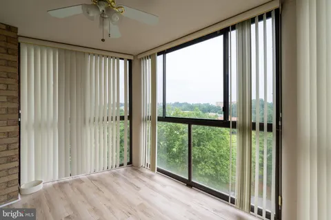a view of a room with a large window