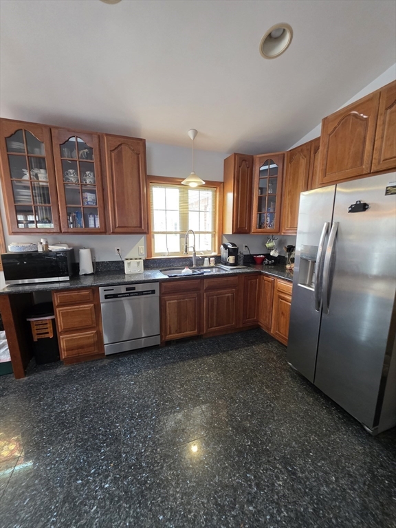 700 Old Fall River Road, Unit 12 Dartmouth, MA 02747 - Photo 17 of 31 a kitchen with stainless steel appliances granite countertop a refrigerator a sink a stove and a dishwasher