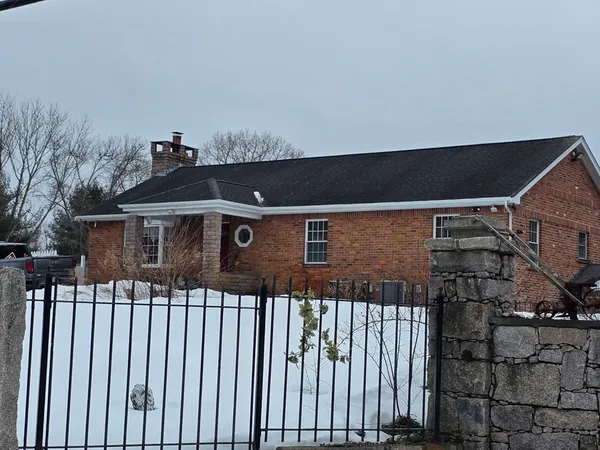 a kitchen with stainless steel appliances granite countertop a refrigerator sink and stove