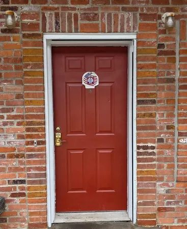 a living room with furniture a rug and a window
