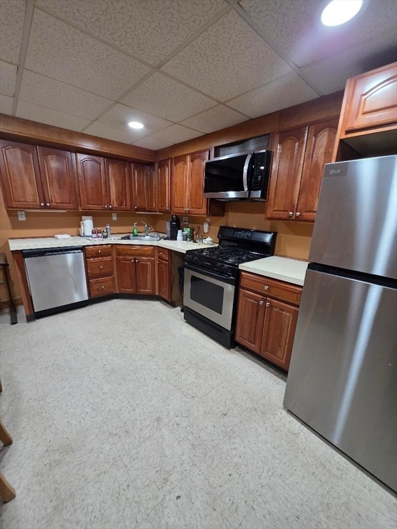 700 Old Fall River Road, Unit 12 Dartmouth, MA 02747 - Photo 5 of 31 a kitchen with stainless steel appliances granite countertop a refrigerator sink and stove
