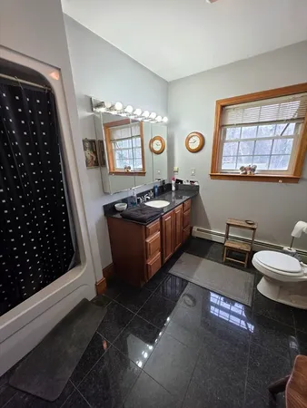 a kitchen with stainless steel appliances granite countertop a refrigerator a sink a stove and a dishwasher