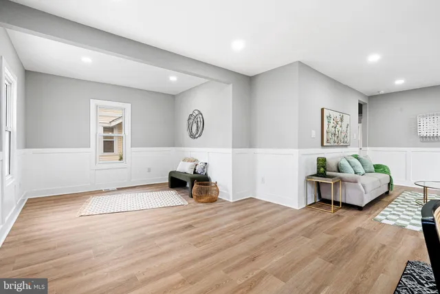 a spacious bedroom with a bed and a couch