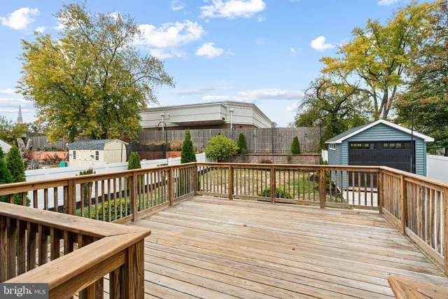a view of wooden deck and a garden