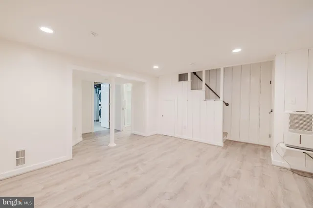 a bathroom with a sink a mirror and shower