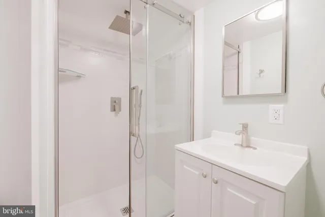 a picture of a bench in a white wall