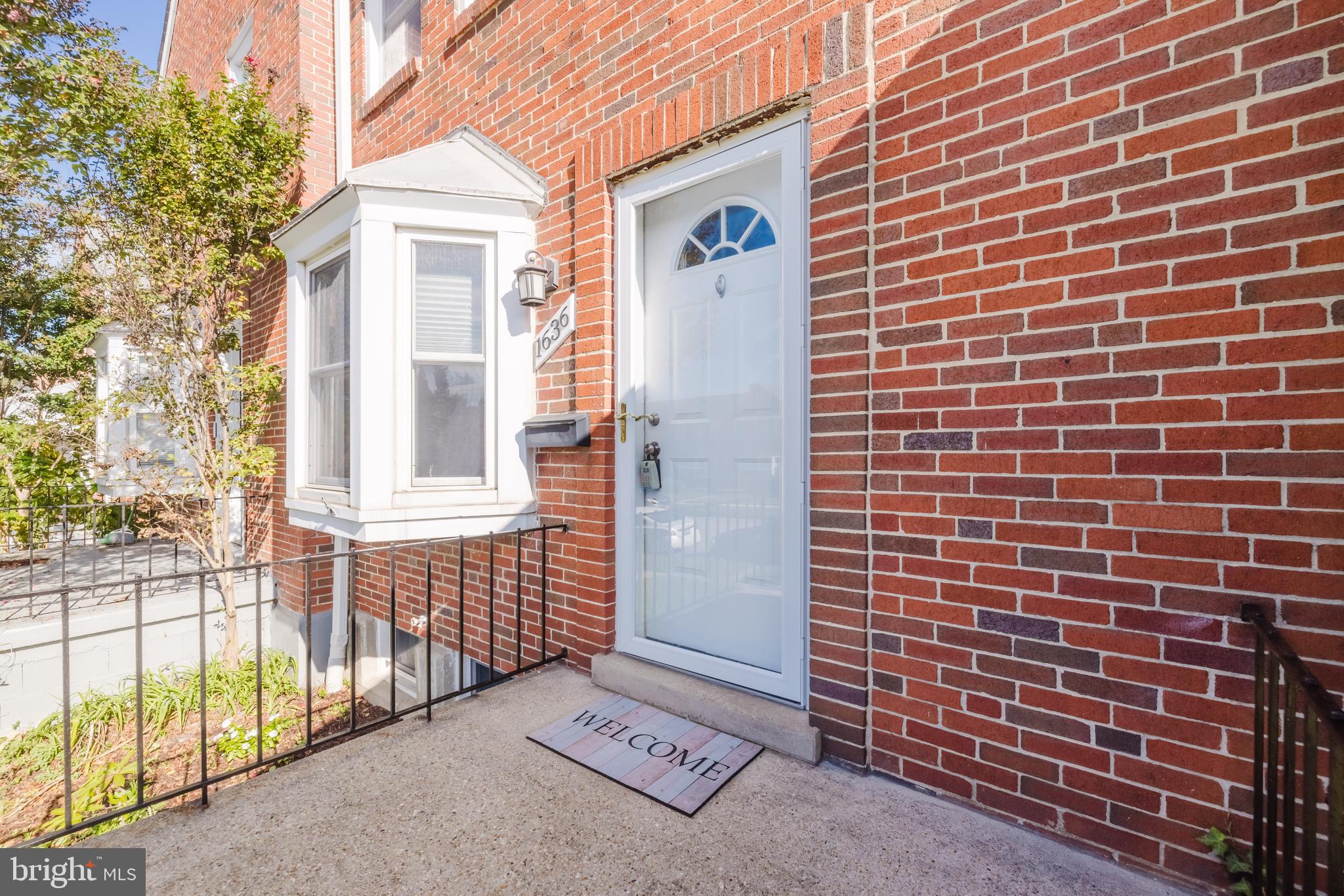 1636 Thetford Road Baltimore, MD 21286 - Photo 2 of 23 a view of a brick wall of the house