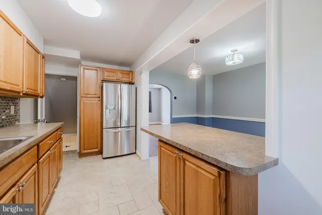 a kitchen with stainless steel appliances white cabinets and a sink
