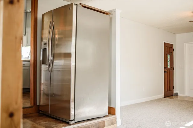 a bathroom with a glass shower door