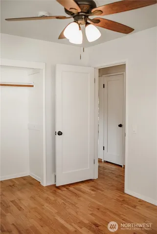 a view of a room with wooden floor and walls