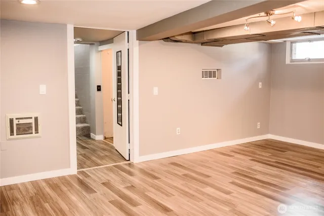 a view of bathroom with wooden floor