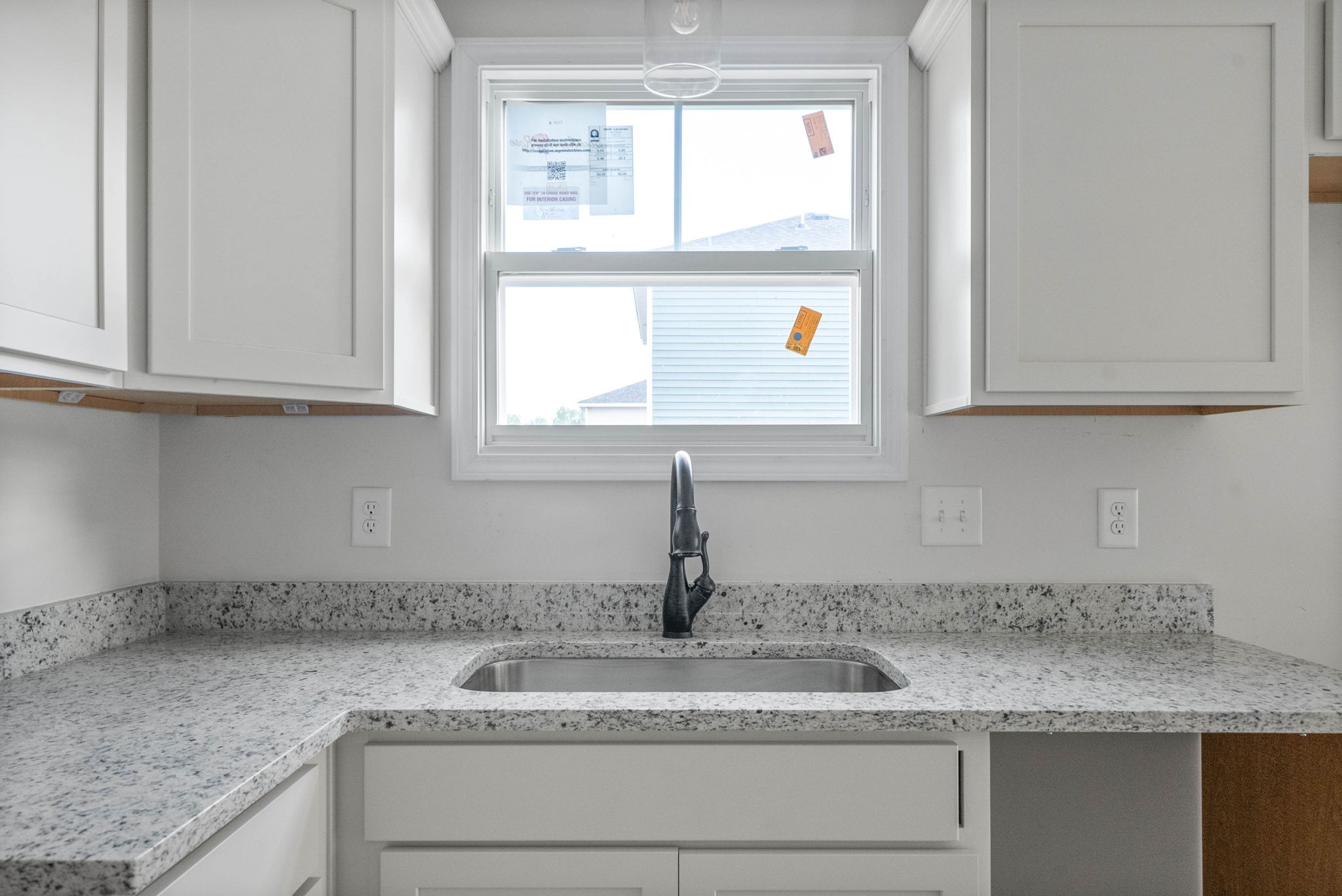 238 Wayne Hall Road Clarksville, TN 37040 - Photo 12 of 26 a kitchen with granite countertop a sink window and cabinets