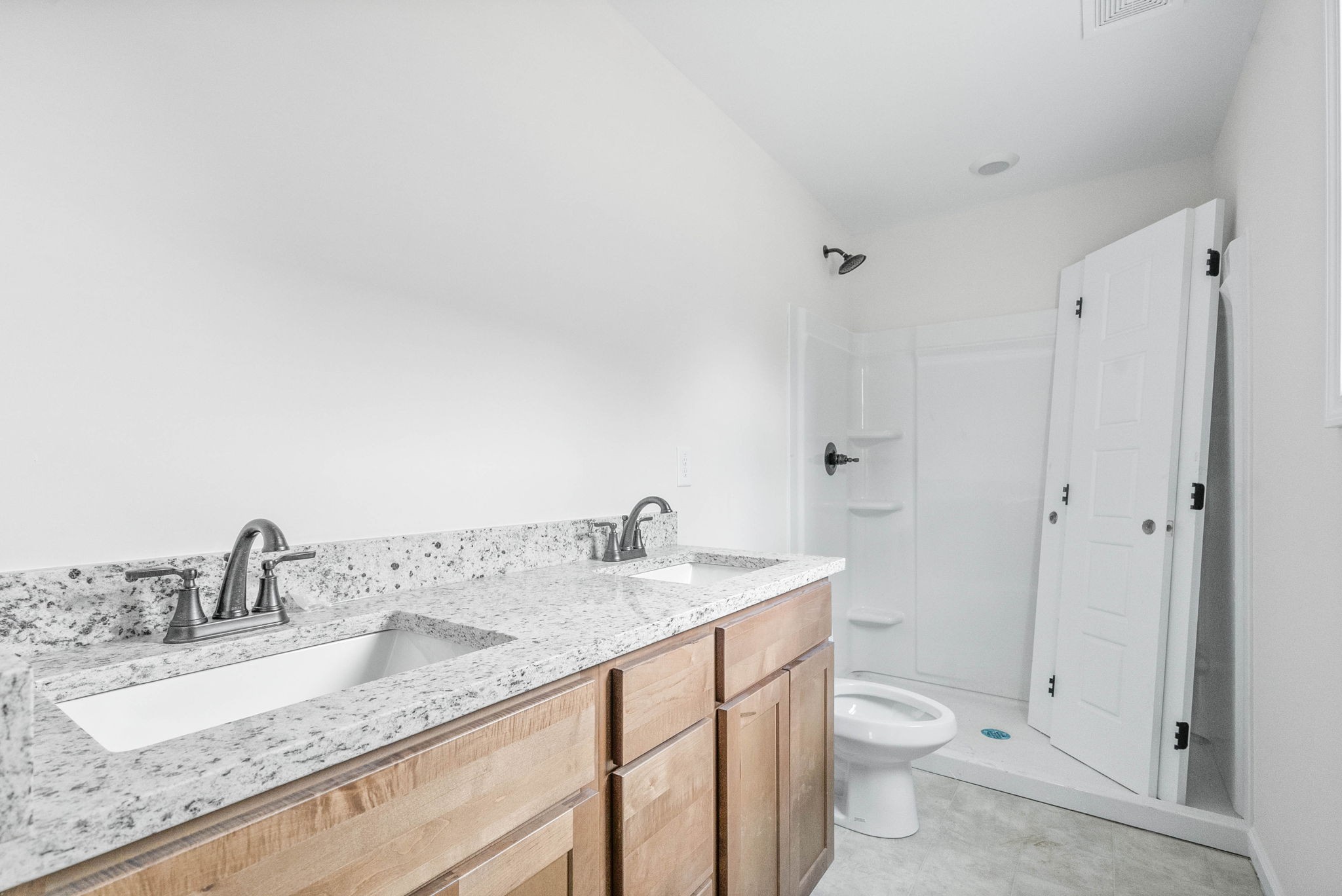 238 Wayne Hall Road Clarksville, TN 37040 - Photo 16 of 26 a bathroom with a granite countertop sink a toilet and a mirror