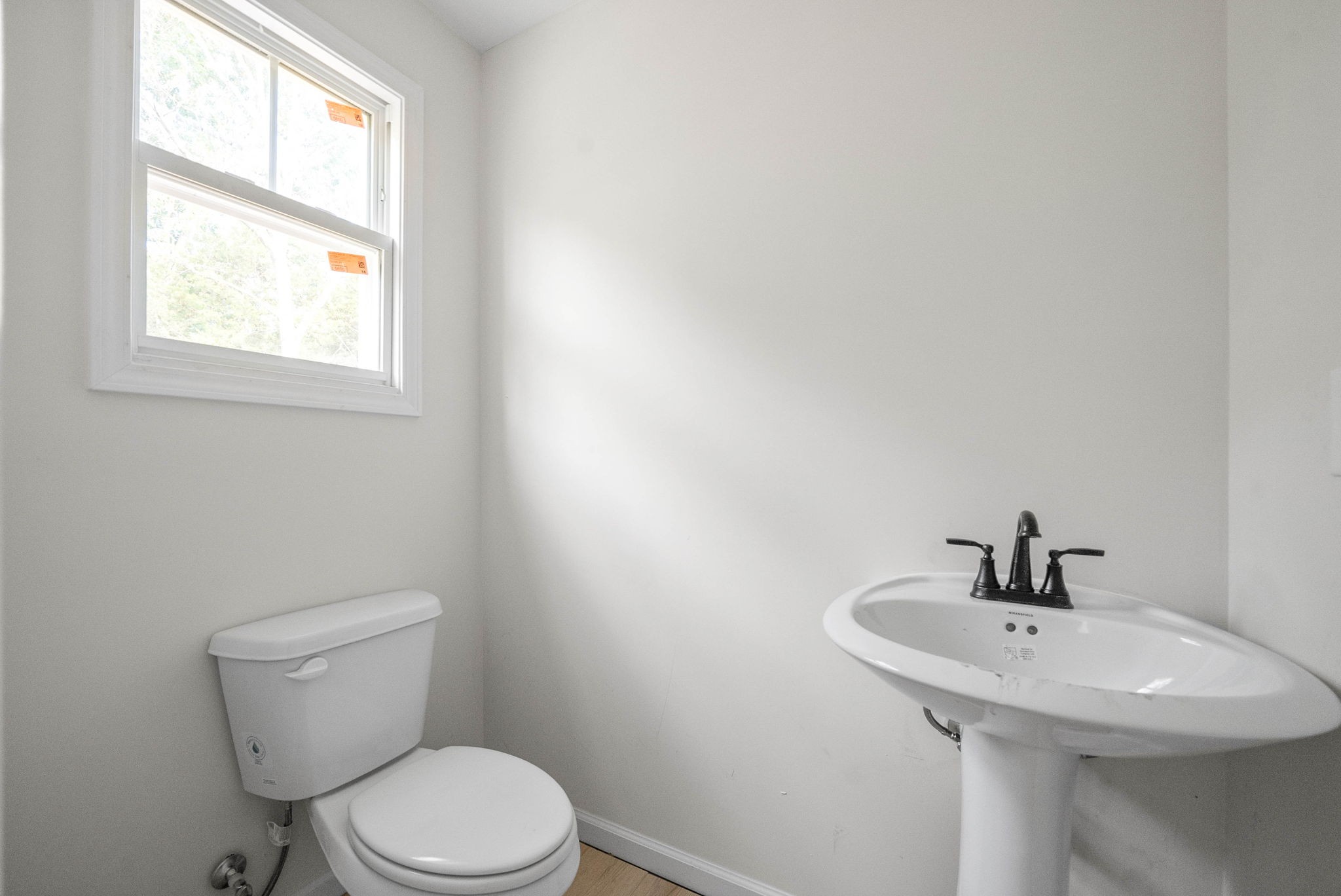 238 Wayne Hall Road Clarksville, TN 37040 - Photo 17 of 26 a bathroom with a sink a toilet and a window