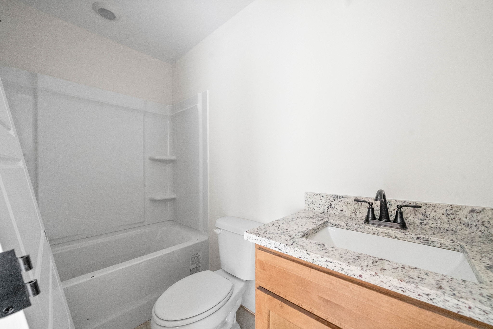 238 Wayne Hall Road Clarksville, TN 37040 - Photo 22 of 26 a bathroom with a granite countertop sink toilet and bathtub