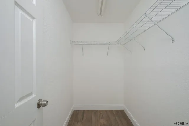 a view of a room with racks on the wall