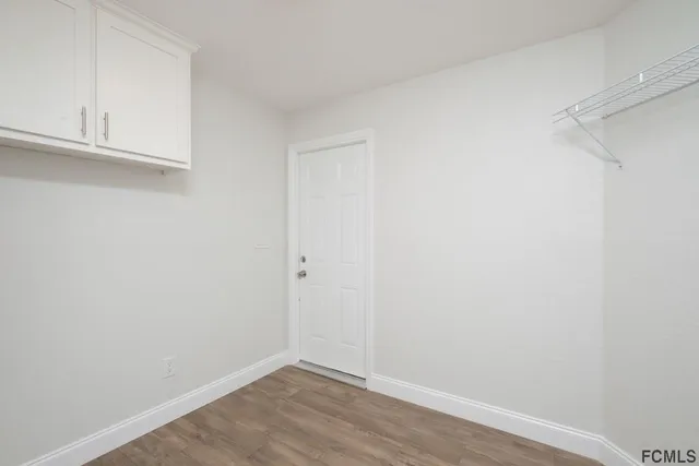 a view of small space with wooden floor