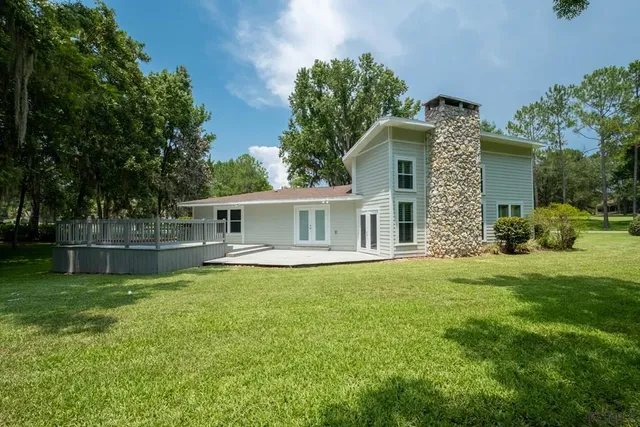 a view of backyard with green space