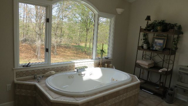 1143 Klopfer Road Macon, GA 31210 - Photo 13 of 19 a bathroom with a sink and a window