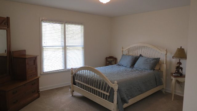 1143 Klopfer Road Macon, GA 31210 - Photo 14 of 19 a bedroom with a bed and a window