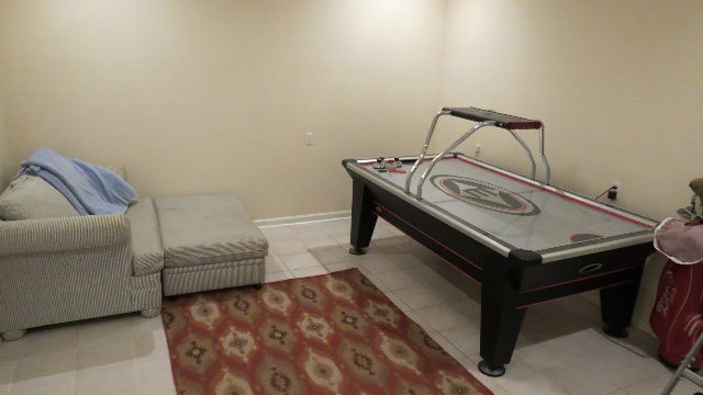 1143 Klopfer Road Macon, GA 31210 - Photo 15 of 19 a living room with a couch and a table
